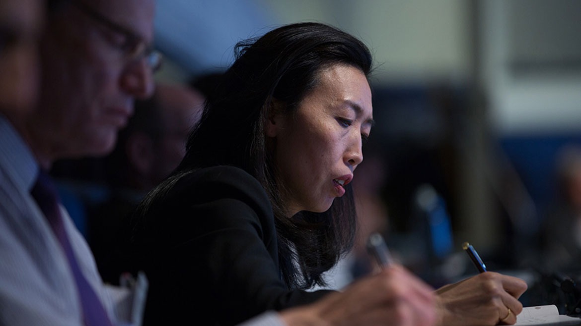 An attendee taking notes at the Gender and Career Progression conference