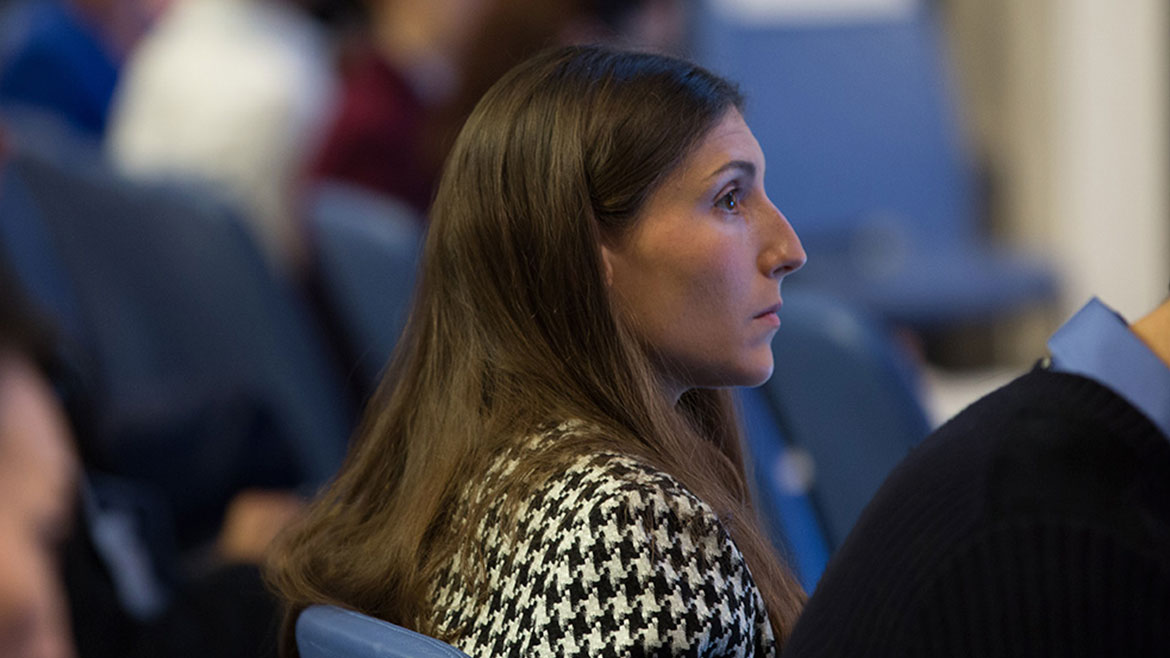 An attendee listening at the Gender and Career Progression conference