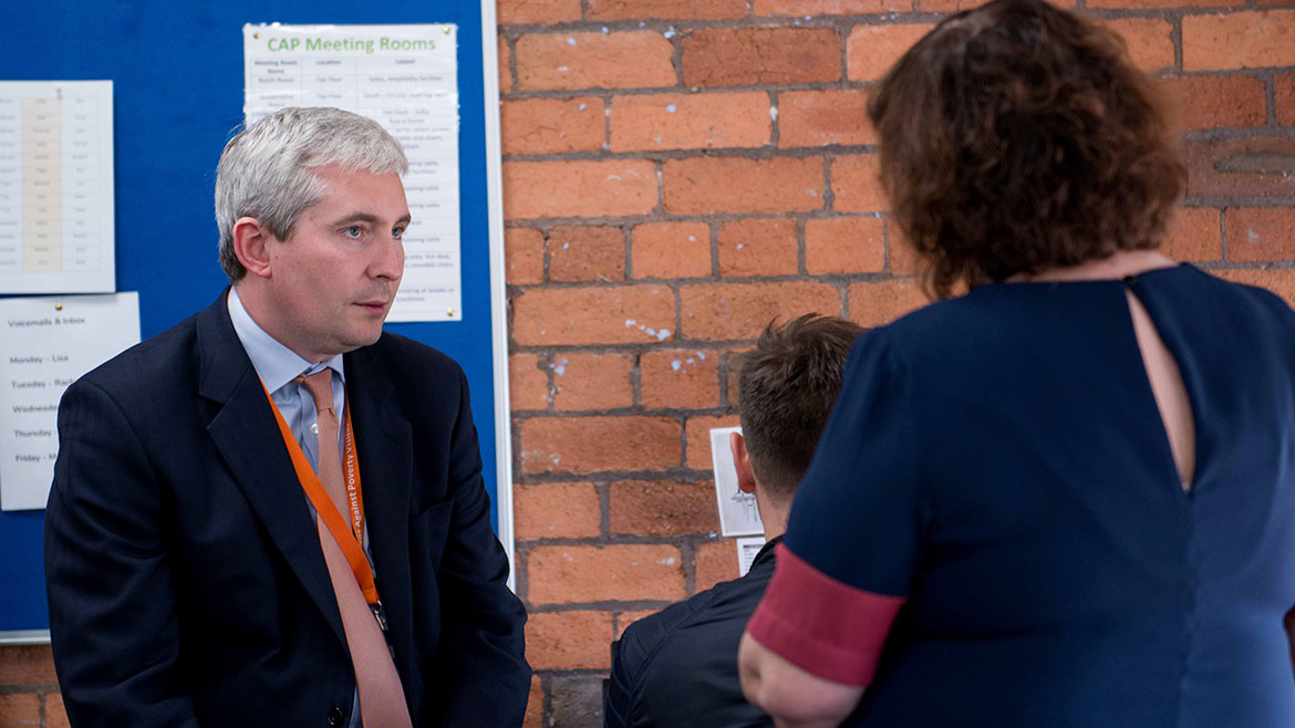 Alex Brazier speaking at a community forum in Bradford