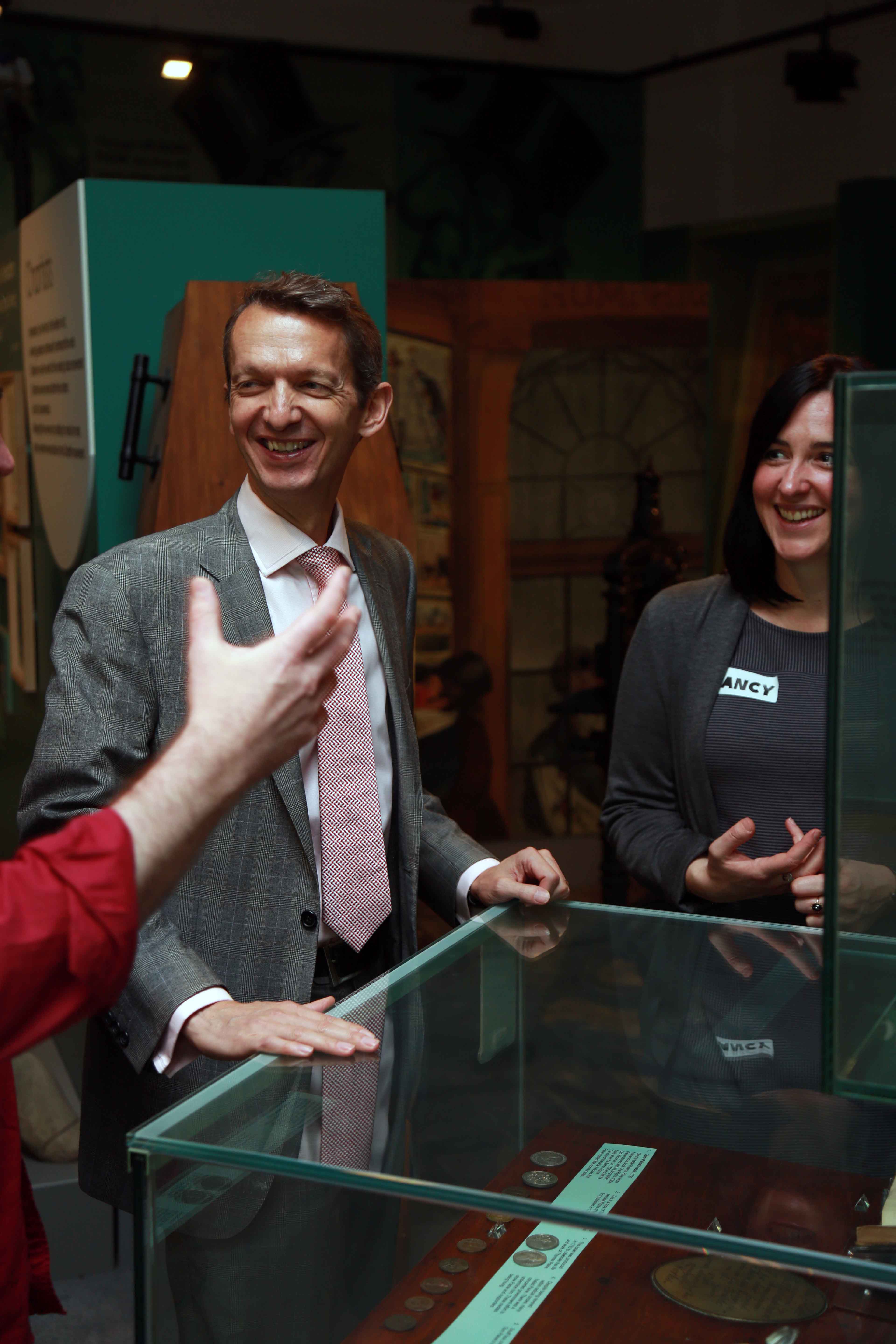 Andy Haldane looking at a museum exhibit