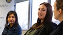 People speaking at a meeting